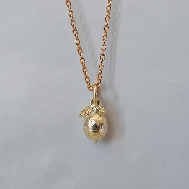 Little Zest lemon charm on a gold chain