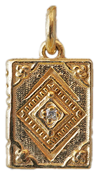 Next Chapter solid gold book charm with a natural diamond, cut out