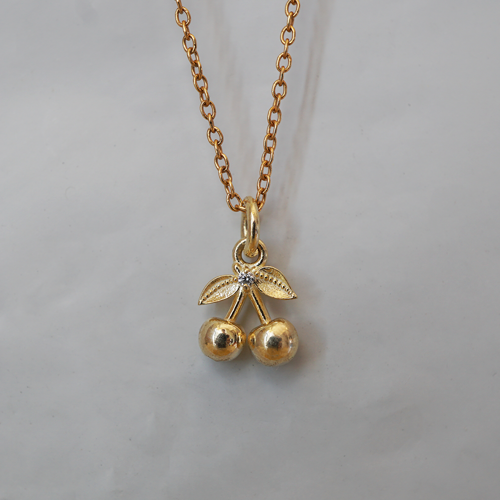 Cherry on Top solid gold double cherry charm with leaves and a natural diamond