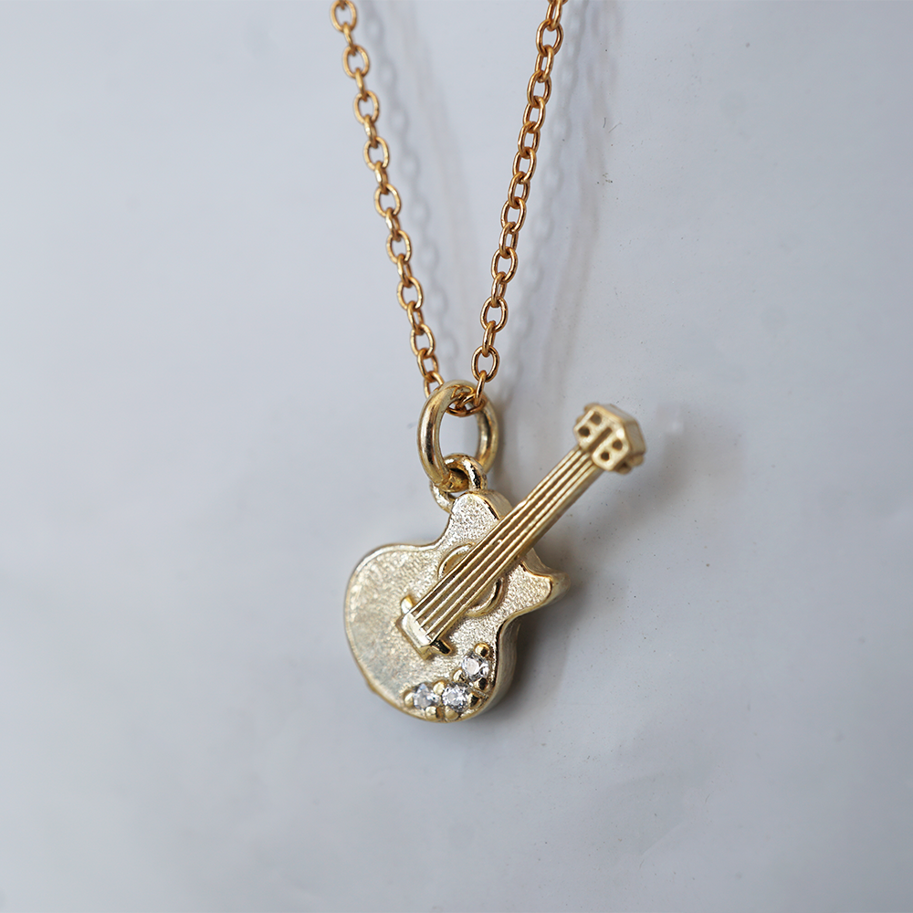 Encore solid gold guitar charm with fine strings and natural diamonds
