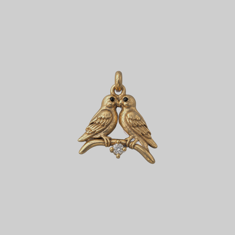 Lovebirds solid gold charm of two birds on a branch with a natural diamond