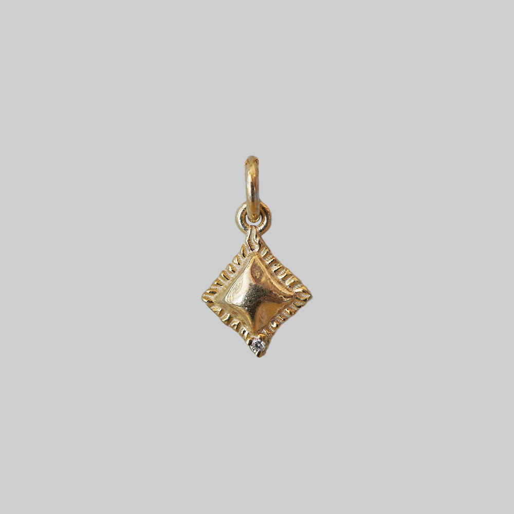 Al Dente solid gold ravioli charm with crimped edge and a natural diamond, alternate view