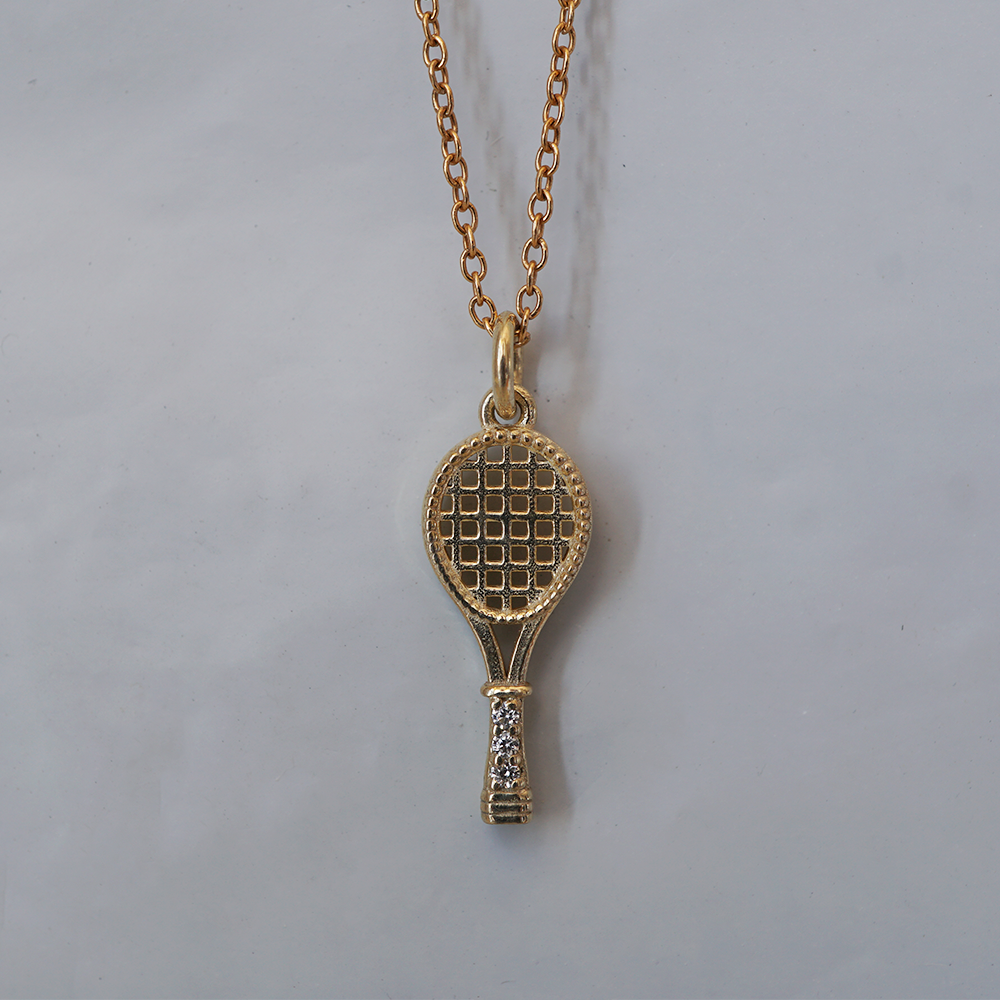 Ace solid gold tennis racket charm with openwork strings and natural diamonds