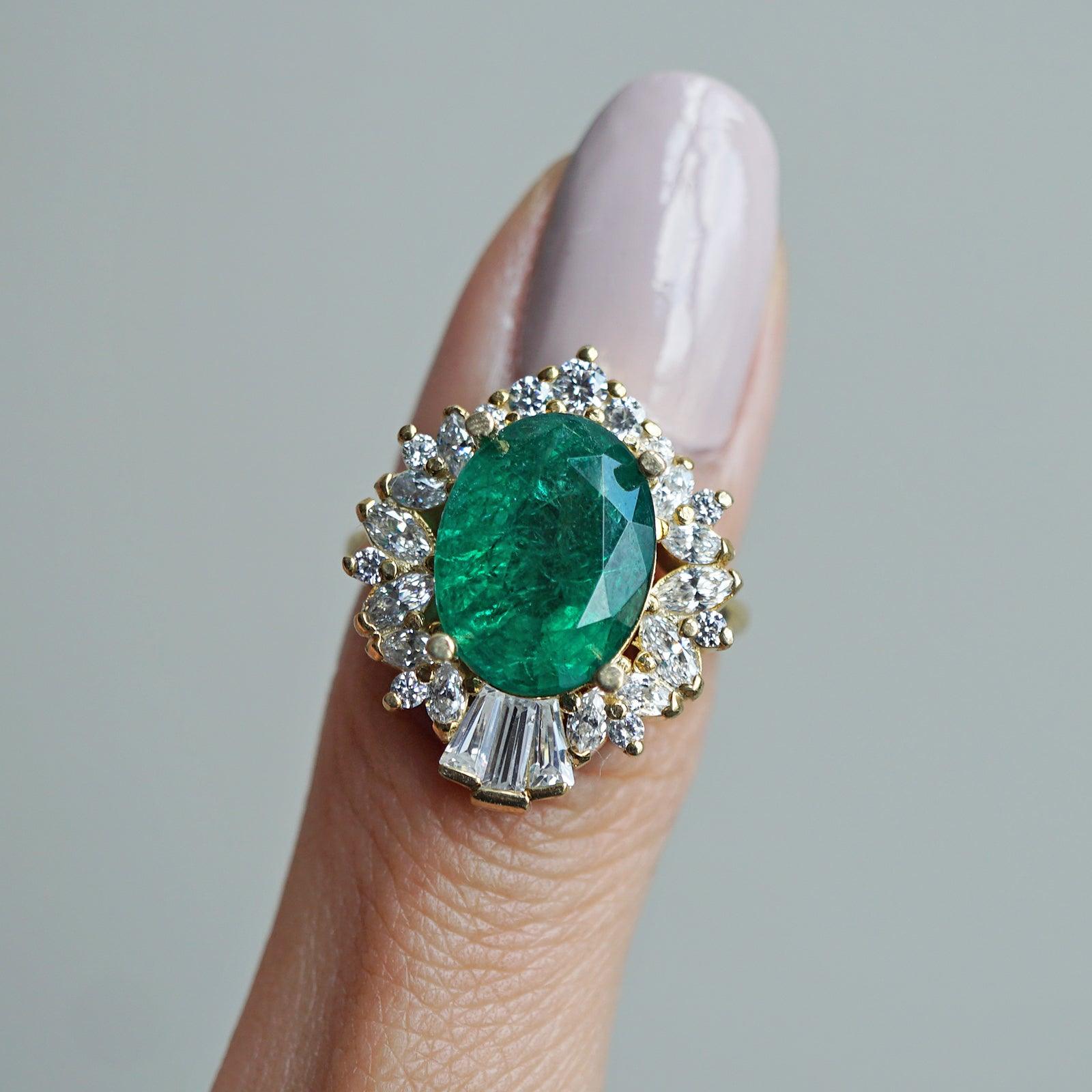 18ct White Gold Oval Cut 0.35ct Emerald and 0.49ct Diamond Halo Ring